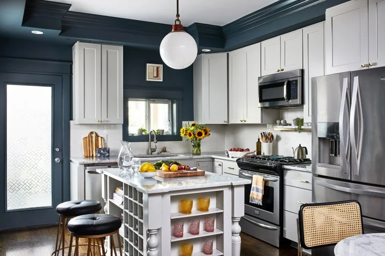 Dark Wall Kitchen, White Cabinets, Island With Storage, Two Barstools