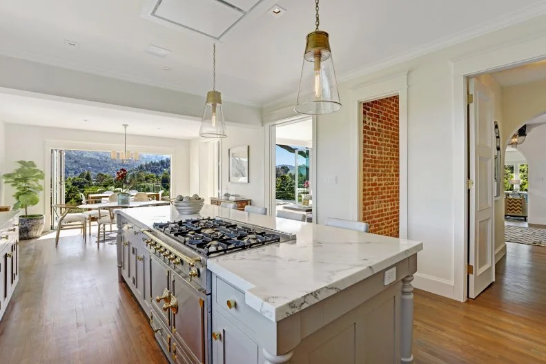 Brass Hardware on Marble Island with Cooktop, Brass Pendants Above