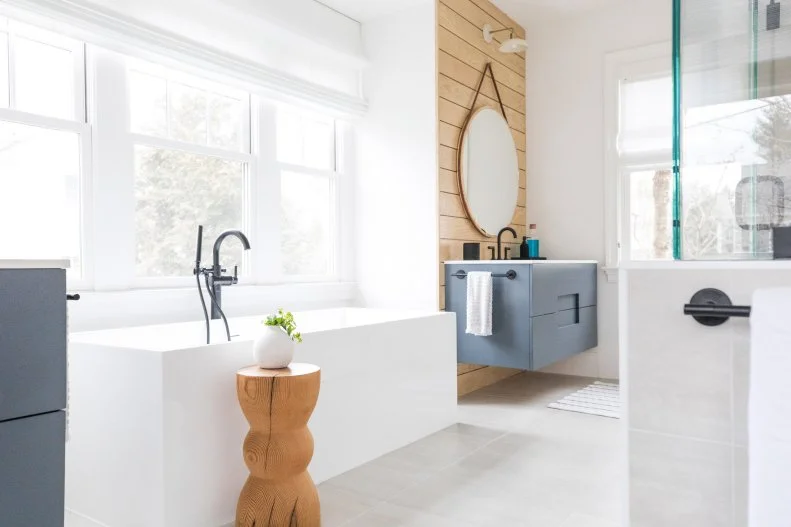 Modern Bathroom Features a Square Tub and a Floating Vanity 