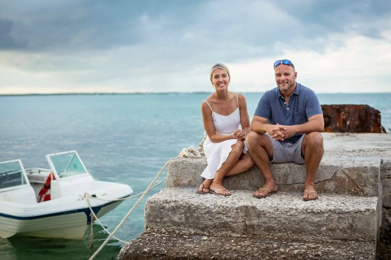 Bryan and Sarah posed by the ocean