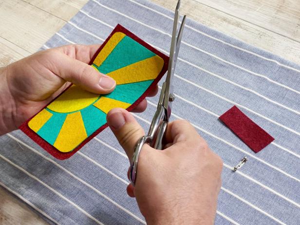 Peel off the adhesive backing of each piece. Then recreate and assemble the patch you designed. Iron together by carefully pressing the iron on to the patch, lift and repeat. Do not slide or your design will shift. Tip: Trim and adjust the design as needed.