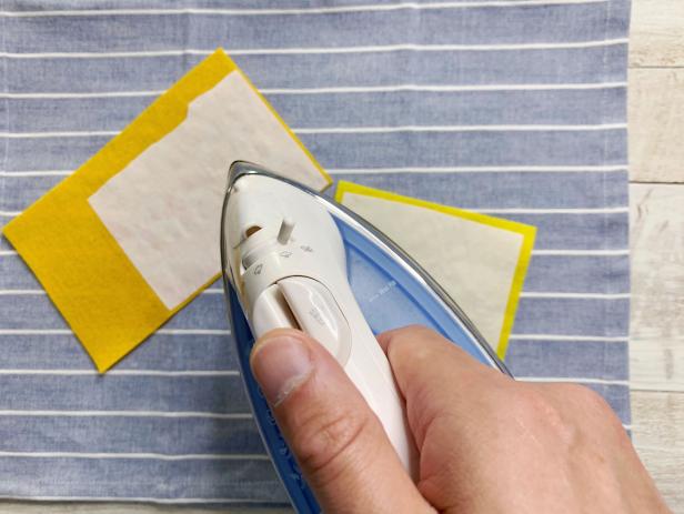 Attach the iron-on adhesive to one side of the pieces of felt you need for your patch. Tip: Save felt by only using the size you need to create your design.