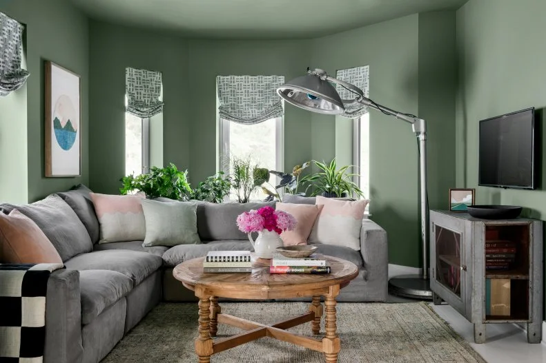 Gray Sectional Sofa Creates Cozy Sitting Nook in Green Living Room