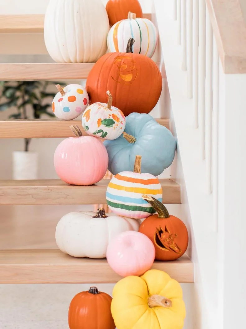 Sugar and Cloth blogger Ashley Rose painted (and carved!) an array of mini pumpkins in shades of pastels. Then she stacked them on her staircase for a layered Hallo-cute look. 