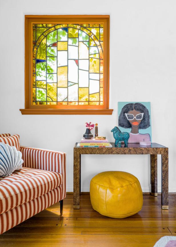 Eclectic Sitting Area With Yellow Pouf