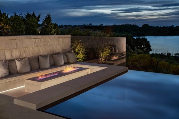Fire Table Offers Cozy Corner for Evening Swims