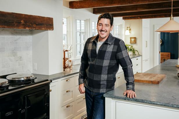 As seen on HGTV's Farmhouse Fixer, Jonathan Knight and his designer Kristina Crestin, work to revitalize farmhouses in the northeast. He poses for a portrait in the renovated kitchen of a farmhouse in Ipswich, Massachusetts.