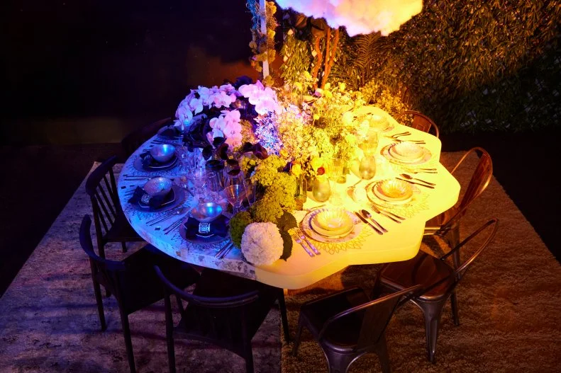 As seen on Table Wars, contestants Rachel Burt Garcia and Wilfredo Emanuel created a tablescape around the theme was "Day/Night." They suspended and lit clouds over their table.