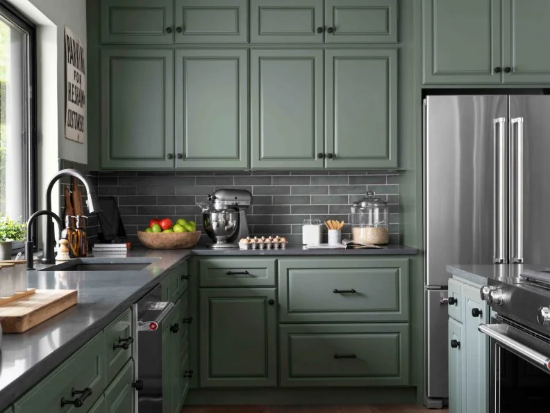 The combination of knobs on upper cabinets and pulls on drawers add dimension and texture to this impressive kitchen, with all kinds of storage options.