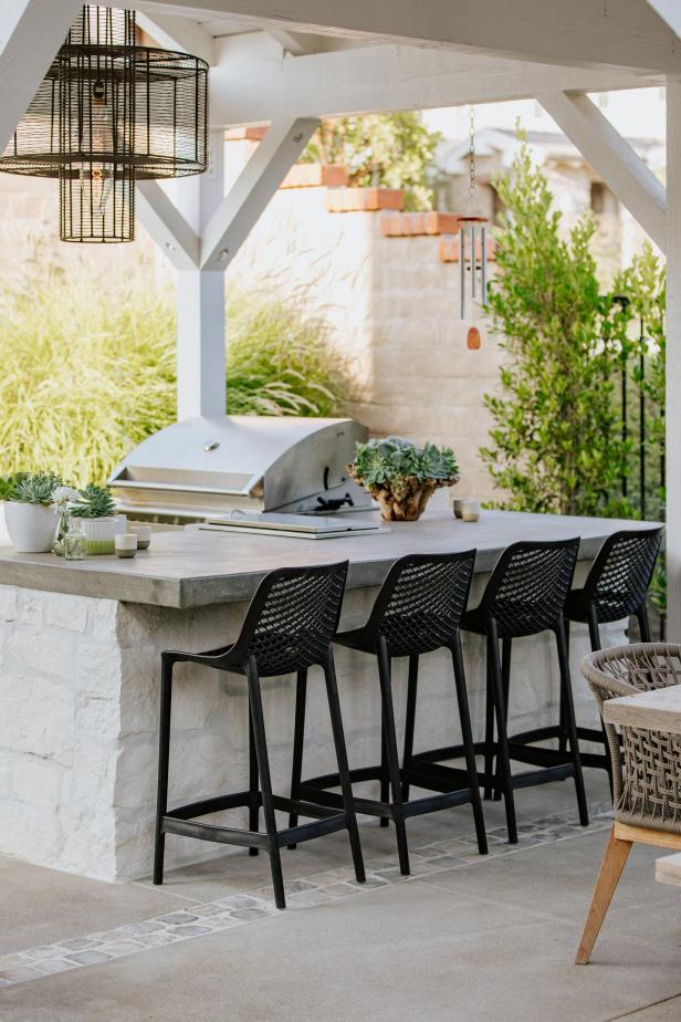 Outdoor Bar With Black Stools
