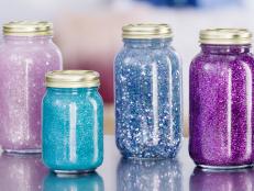Pink, light blue, dark blue, and purple glitter jars 