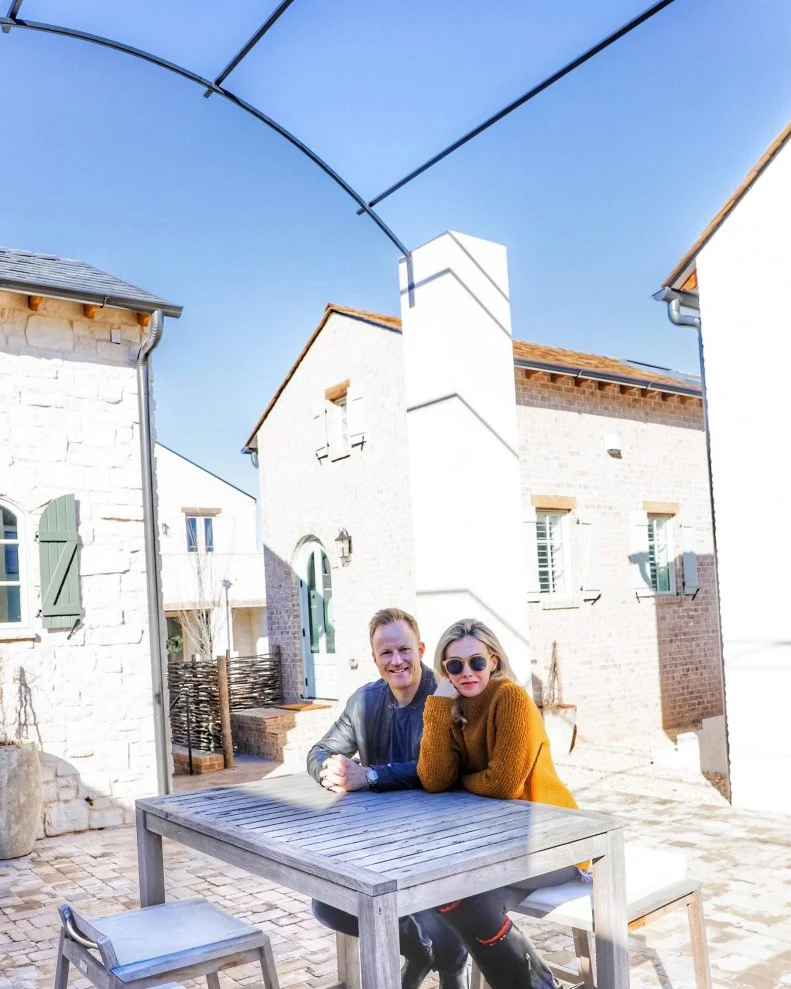 These homeowners sit in an outdoor courtyard.