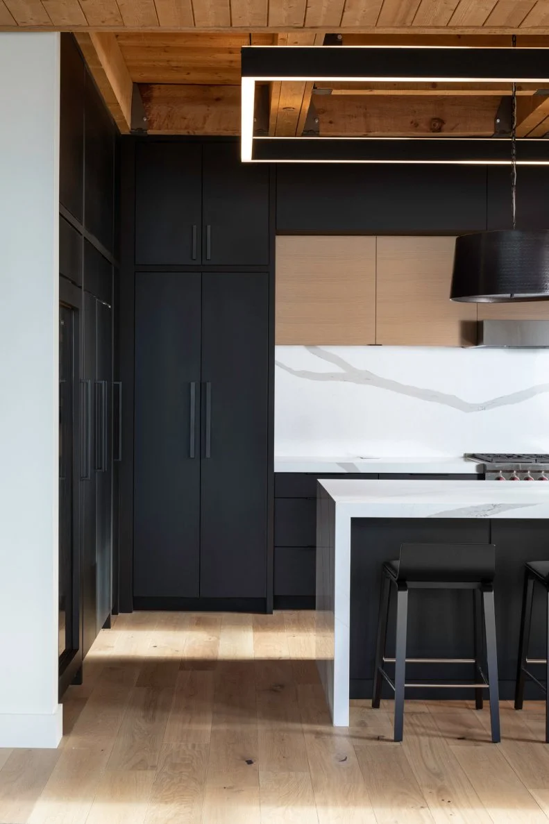 Black Kitchen With Wood Ceiling