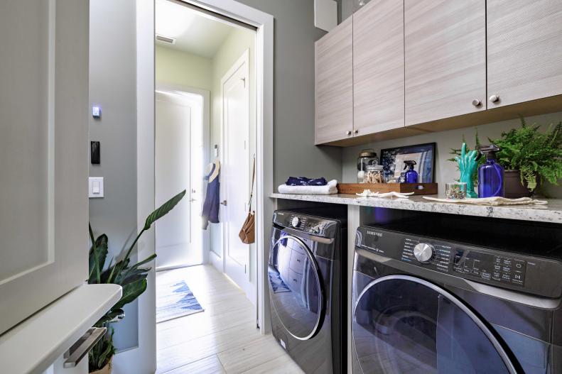 The laundry room and other utility spaces in this modern Naples, Florida home are packed with technology, designed to help you efficiently clean and eliminate germs, so you can create a safe and healthy environment.