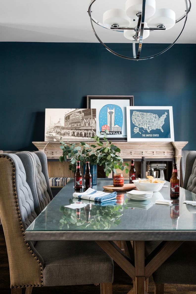 This Nashville townhouse was decorated to have just enough personality to appeal to a wide array of renters and/or possible buyers, but in a manner that was not too specific or tied into one particular style. Neutral navy walls have mass appeal, but also add a dramatic backdrop for almost any style of furniture; art simply grouped together and leaned on walls avoids extra costs for painters to repair and repaint walls. 

