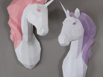 White unicorns, one with pink mane and one with purple mane on wall