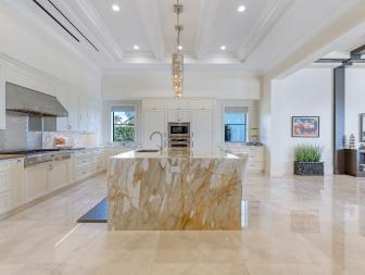 Neutral Chef Kitchen With Brown Marble Island