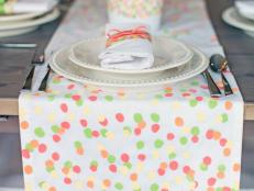 Get the kids involved in crafting and decorating for Mother's Day brunch by personalizing a plain white table runner with colorful fingerprints.