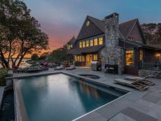Traditional Home with Infinity Pool, Hot Tub, Stone Walkway at Sunset