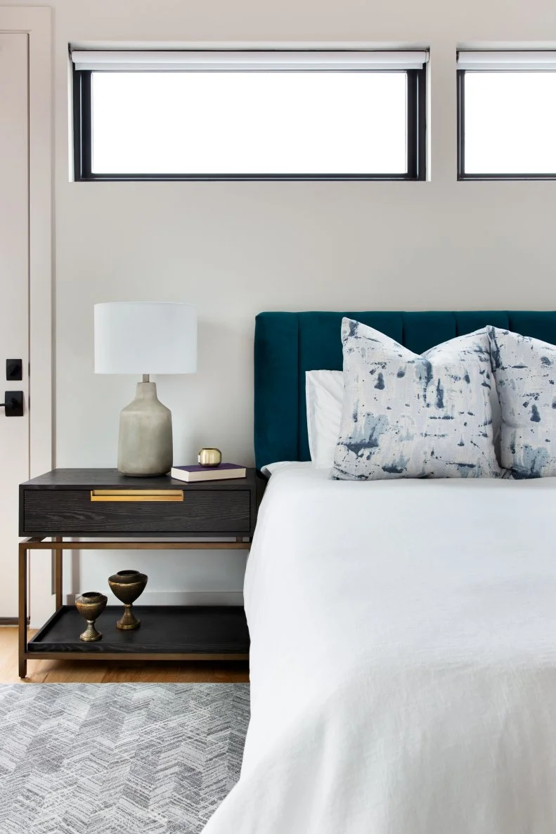 "Add storage furniture or baskets to your room so that you can tuck away miscellaneous items and keep them tidy, since a cluttered room can cause anxiety and mess with your sleep. I recommend a storage bench for the end of your bed or a storage-friendly bedside table - decorative, yet functional," says designer Sara Barney.
