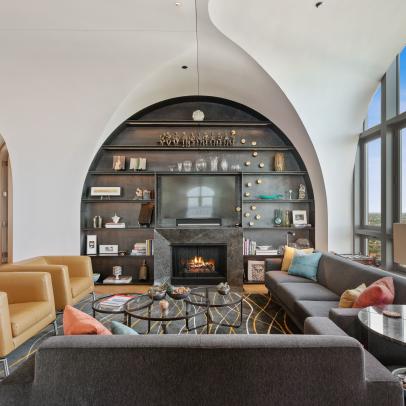 Living Room With Arched Built-In, Modern Furniture and a Large Arched Window