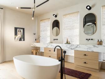 Main Bathroom With Marble Counter and Oval Tub