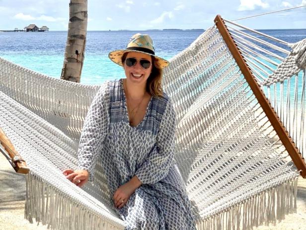 Luxury travel planner Alexandra Stockton on a hammock at the beach