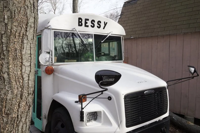 School Bus Painted White, Name on Front "Bessy"
