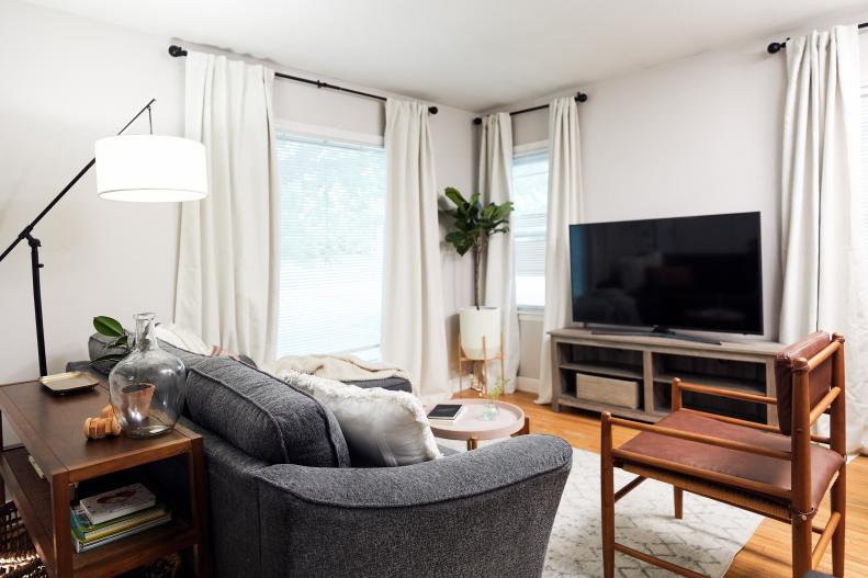 This living room in a rental was stylishly updated for remote work and children's play.