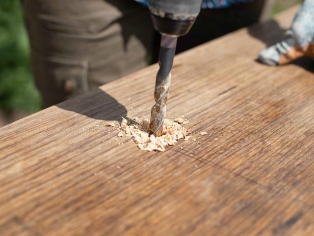 An upcycled table becomes a garden for growing greens.