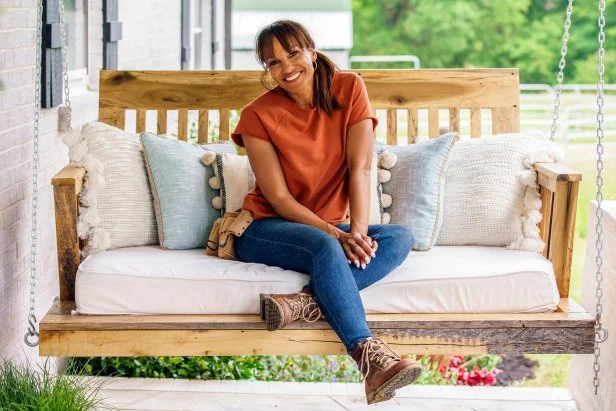 Portrait of Rachel Taylor hanging out on Katie and Trents newly renovated front porch, as seen on Curb Appeal Xtreme.