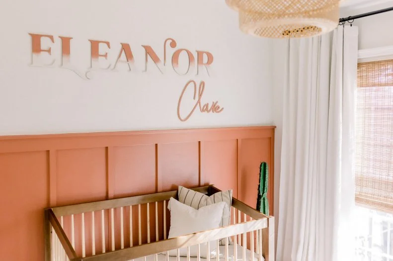 Nursery With Orange Wainscoting