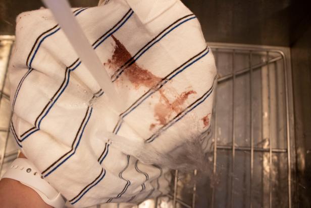 Treating clothing to remove red wine stains.