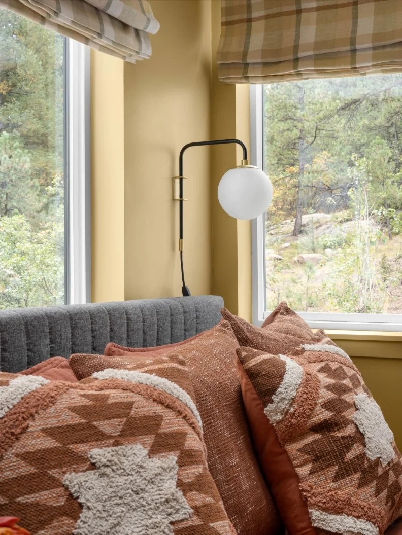 Gold Bedroom With Globe Sconce