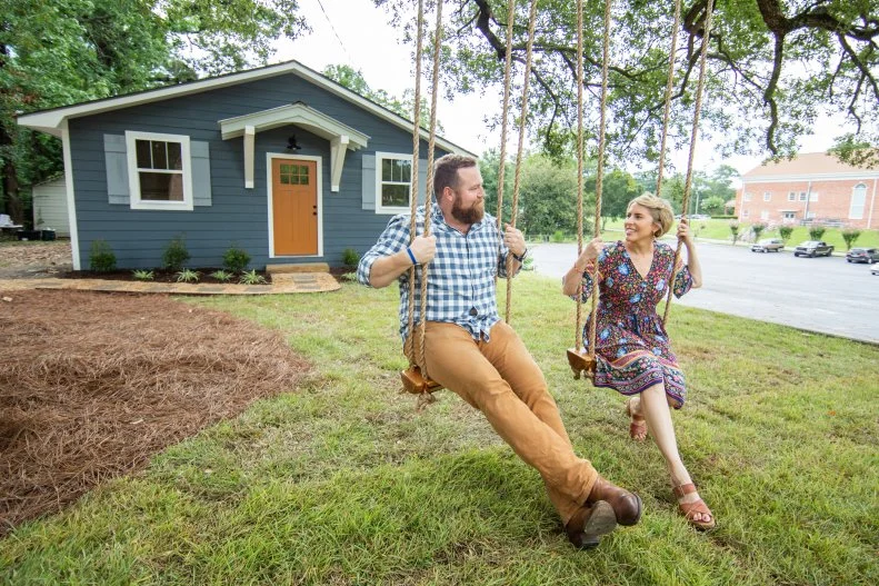 As seen on HGTV’s Hometown, Ben and Erin Napier share a moment on the swings Ben built in his workshop for the Everett house.