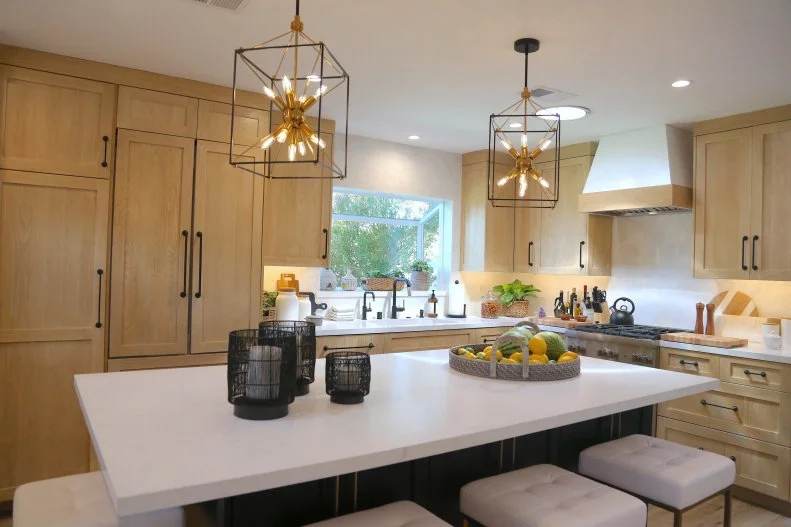 Detail of the large island and added lighting fixures in the newly renovated Long Beach, CA kitchen as seen on HGTV's Christina on the Coast.