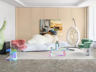 Neutral room with sculptural pastel furniture. 