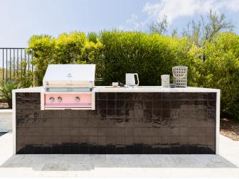 Black Outdoor Kitchen Island and Pink Grill