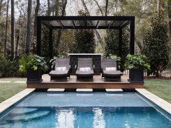 Unwinding after a long day is dreamier poolside and under the pergola in the backyard at HGTV Smart Home 2022. With ample seating and a large dipping pool, this home makes it easy to beat the heat and unwind after a day spent kayaking North Cape Fear River.