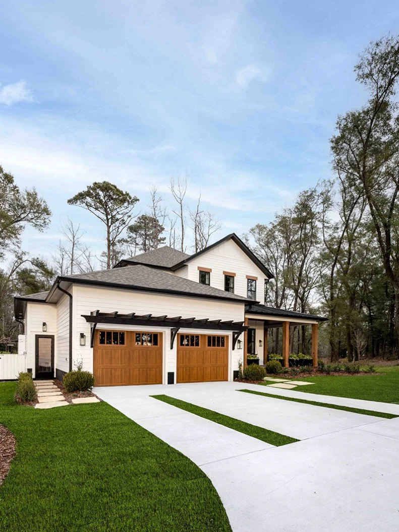 The spacious concrete driveway to the garage offers parking space for two cars, and creates a focal point for the front of the property