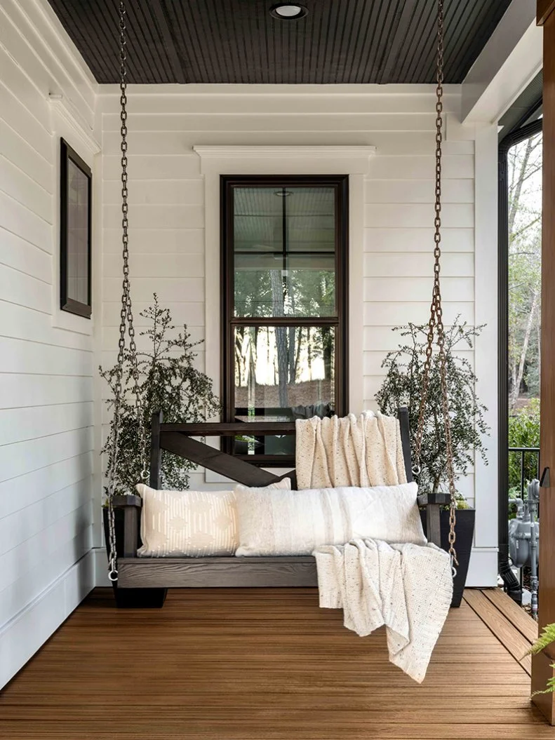 The front porch includes two inviting porch swings built by local Wilmington surfer Cody Frennea, who crafts functional art from the finest woods he can find. One swing sits by the home’s front entry, while the other enjoys a cozy spot where the porch wraps around the side of the house. 