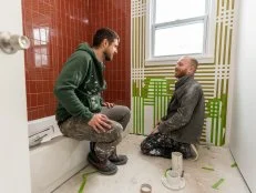 Keith and Evan taping and painting at the bathroom of the Greenview home