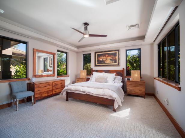 Tropical Bedroom With Wood Baseboards