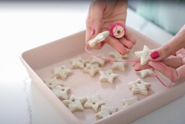 These salt dough ornaments are an easy activity to do with your kids that will entertain them for well over an hour. This fun craft can be easily adapted for any occasion, season, or festival. To make your own you will need 1 cup all purpose flour, 1/2 cup salt, 1/2 cup warm water, 1 tablespoon black pepper, twine, tools, cookie cutters, a rolling pin, baking sheets, parchment paper or silicone mats, and a stainless steel straw.