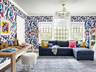 Playroom With Abstract Wallpaper and a Blue Sectional