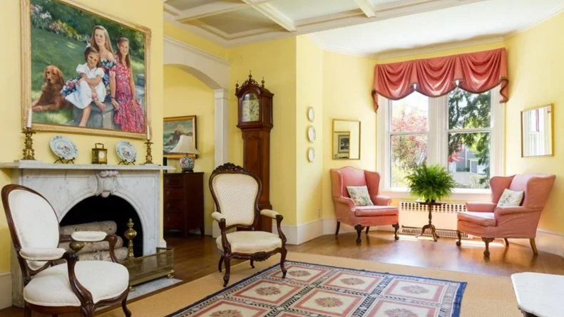 Yellow Formal Room With Old Oil Paintings, Red Drapes on Windows