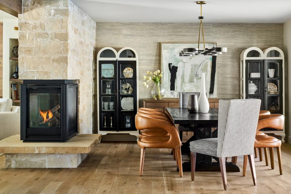 Stone Fireplace in Dining Room, Leather Chairs Around Black Table