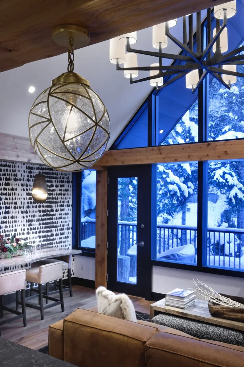 Contemporary Living Room With Large Windows and Modern Chandelier