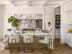 White Contemporary Chef Kitchen With Marble Wall