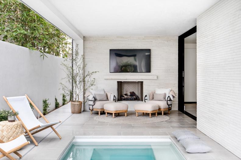 White Brick Walls in Covered Patio, Lap Pool, Fireplace and TV